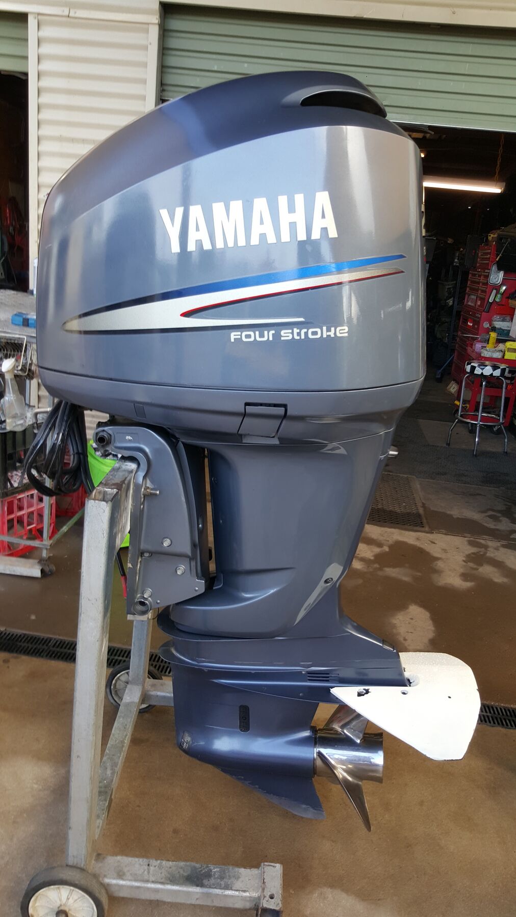 Yamaha F50 four stroke outboard on a stand in the workshop